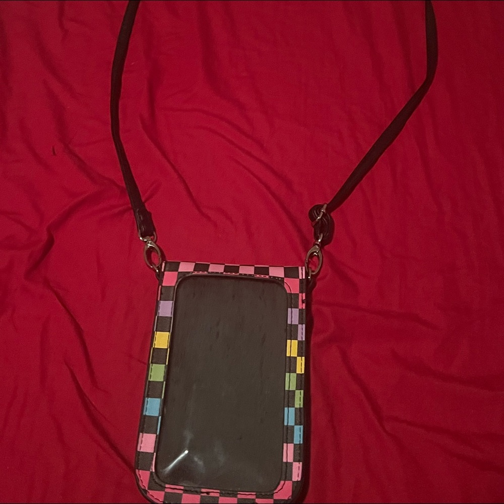 This is a hanging side bag where you can put your phone into it and stuff!